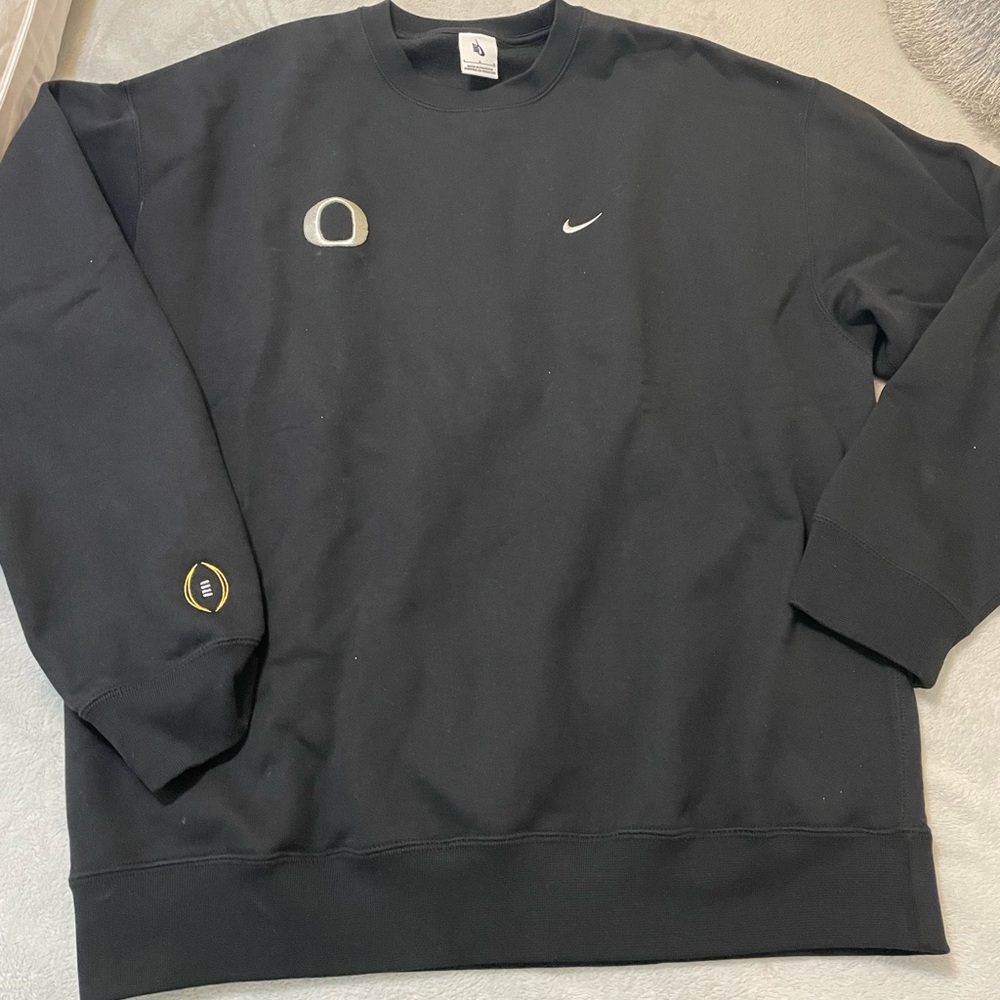 Oregon Football Nike Black Crewneck Sweatshirt. Playoff logo